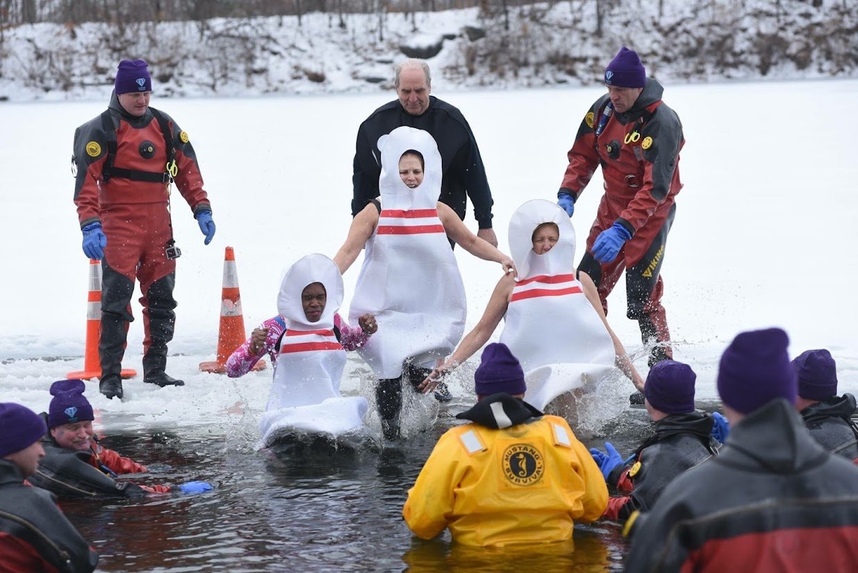Team Strike Out, dressed as bowling pins, jumps into an ice-cold lake. It's all about raising funds to fight Alzheimer's disease.